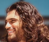Can Yaman smiling at an event in Margherita di Savoia in April 2023