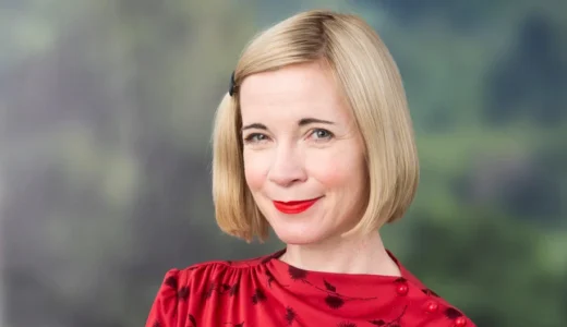 Lucy Worsley wearing a red patterned dress at Hay Festival in 2019